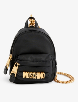 MOSCHINO Logo plaque shell mini backpack Selfridges