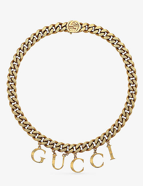 GUCCI: Logo-script gold-toned brass necklace