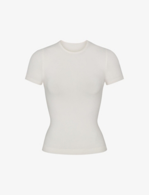 SKIMS - Smoothing slim-fit stretch-woven T-shirt | Selfridges.com