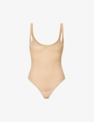 Wolford renames its string bodysuits online; adds sizing reference
