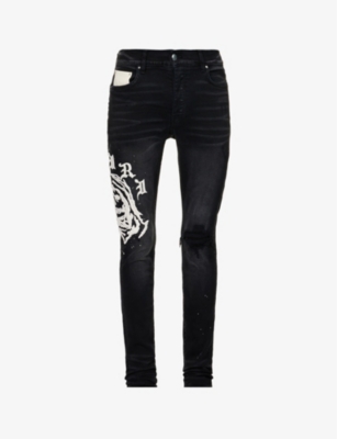 AMIRI AMIRI MENS AGED BLACK X WES LANG REAPER GRAPHIC-EMBROIDERED SLIM-FIT TAPERED STRETCH-DENIM JEANS,59750063