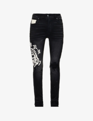 Amiri Wes Lang Reaper Logo Cotton Denim Jeans In Aged Black