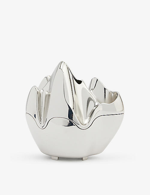 PUBLISHED BY: Abstract-shape chrome-plated metal oil burner