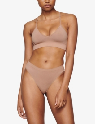 SKIMS: Smoothing mid-rise stretch-woven thong