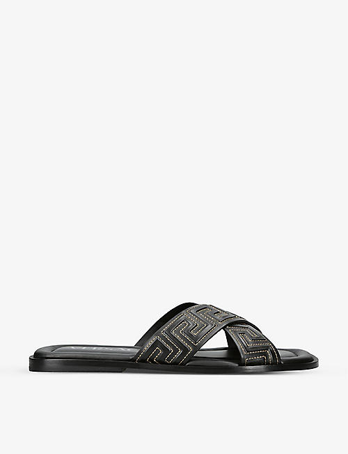VERSACE: Crossover-strap slip-on leather sliders