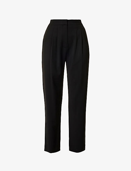 TOVE: Raven pleated tapered high-rise woven trousers