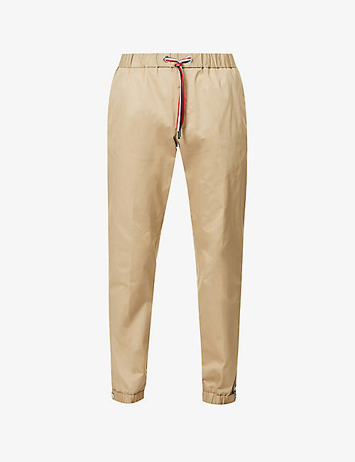 MONCLER: Embroidered-badge elasticated-waist stretch-cotton trousers