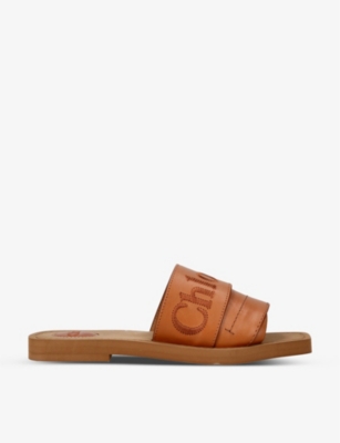 CHLOE Woody logo print leather sandals Selfridges