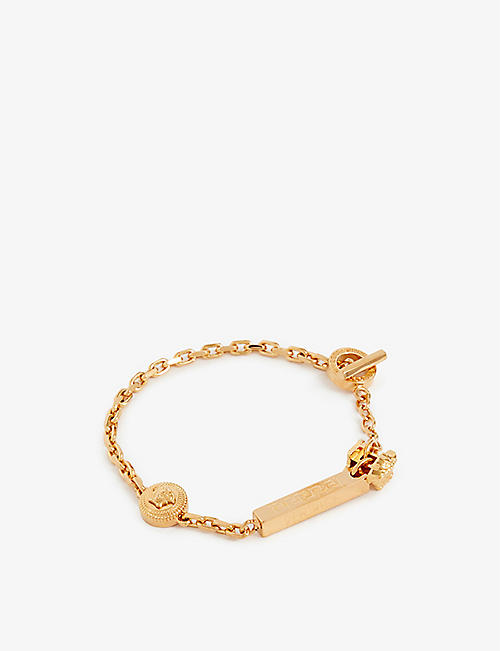 VERSACE: Medusa logo-embellished gold-toned brass bracelet