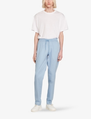 Shop Sandro Men's Bleus Tapered Drawstring-waist Stretch-cotton Blend Trousers
