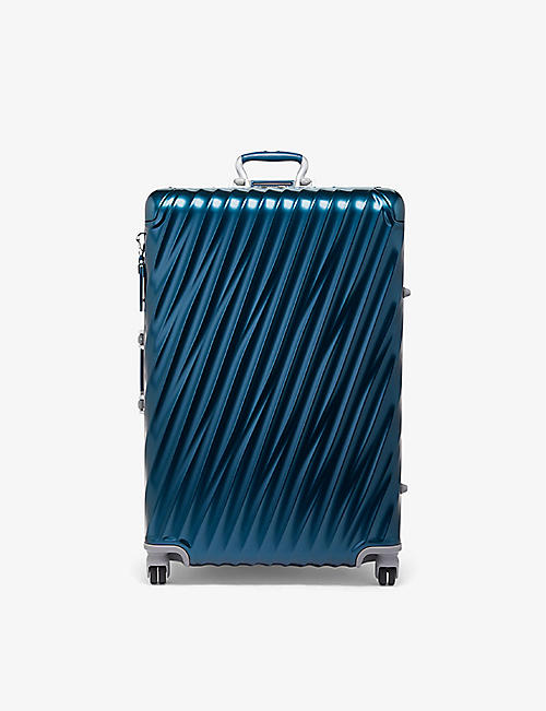 TUMI: Extended Trip expandable four-wheeled aluminium suitcase