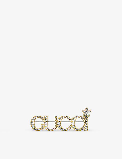 GUCCI: Logo crystal-embellished brass brooch
