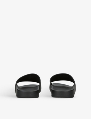 Logo-embossed rubber slides