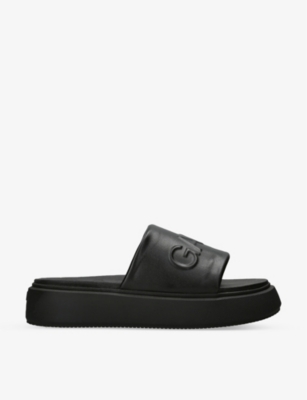 Shop Ganni Logo-embossed Flatform Faux-leather Sandals In Black