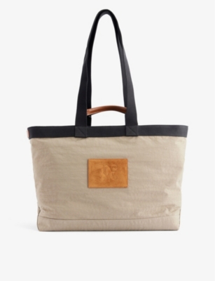 PALM ANGELS Brand patch woven tote bag Selfridges