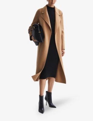 Camel coat over black dress