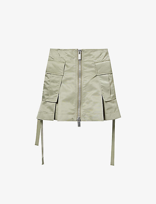 SACAI: Skirt-overlay box-pleat shell shorts