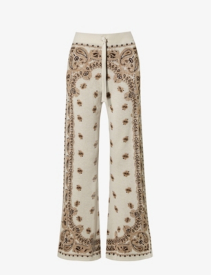 AMIRI AMIRI WOMEN'S WHITE BANDANA PAISLEY-PRINT FLARED-LEG MID-RISE KNITTED TROUSERS