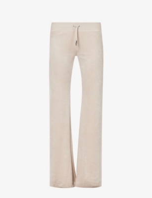 JUICY COUTURE: Layla logo-embroidered velour trousers
