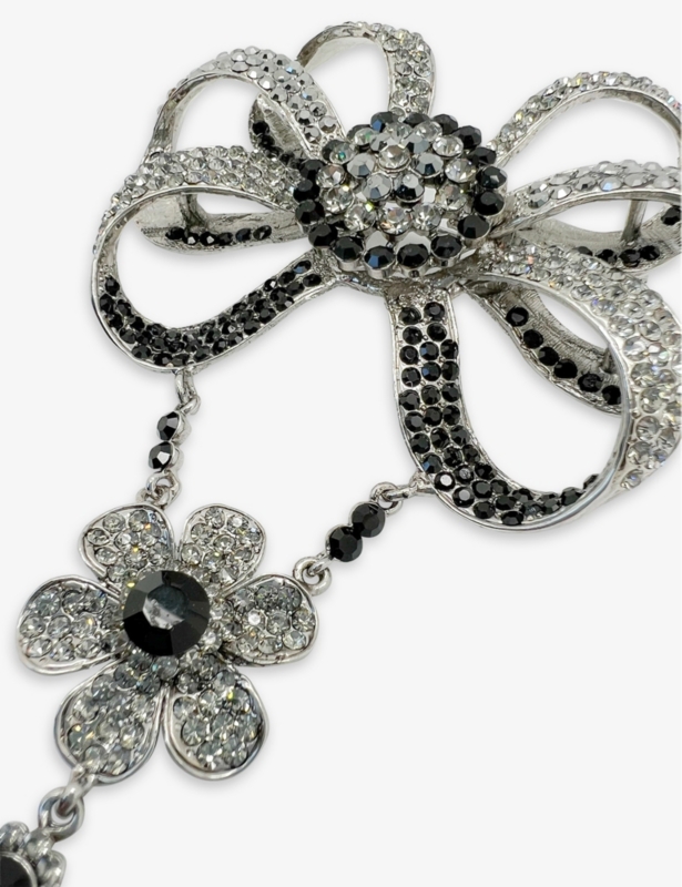 Pre-loved Butler & Wilson bow-shaped metal and faux crystal-embellished brooch