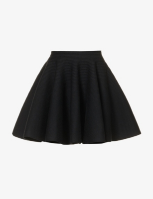 Alaïa Ribbed Flared Mid-rise Wool-blend Mini Skirt In Noir Alaia