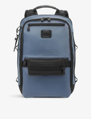 TUMI: Dynamic multi-pocket shell backpack