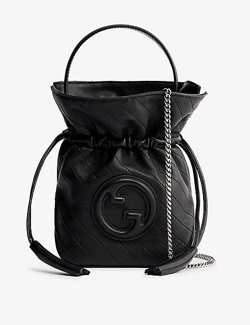 GUCCI: Mini Sakai logo-embossed leather bucket bag