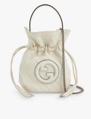 GUCCI Mini Sakai logo embossed leather bucket bag Selfridges