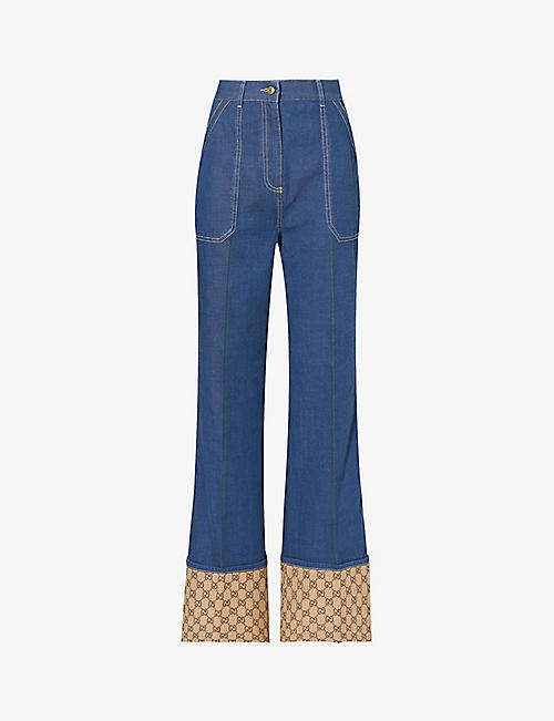 GUCCI: Monogram-cuff flared straight-leg high-rise jeans