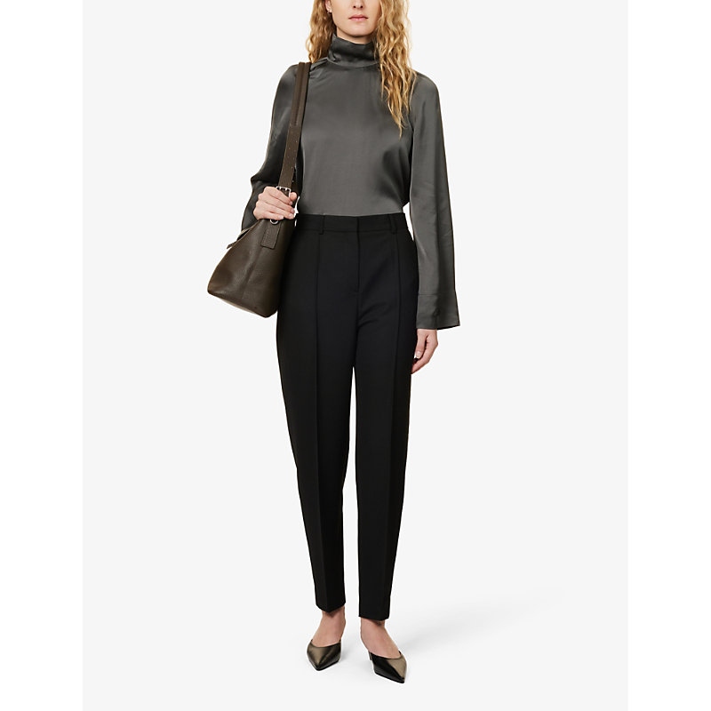 Shop Totême Pressed-crease Tapered Mid-rise Recycled-polyester And Wool-blend Trousers In Black 200