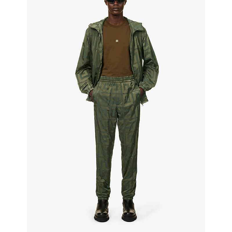 Shop Givenchy 4g-print Tapered-leg Shell Jogging Bottoms In Green