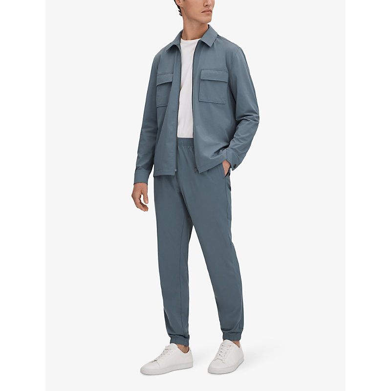Shop Reiss Rival Regular-fit Tapered-leg Stretch-nylon Trousers In Steel Blue