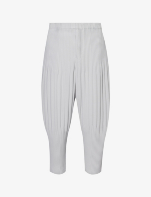 Issey Miyake Basic Pleated Tapered-leg Knitted Trousers In Light Grey