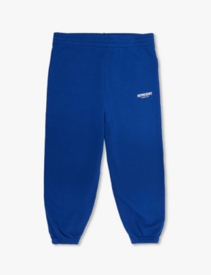 Shop Represent Boys Cobalt Kids Owner's Club Brand-print Cotton-jersey Jogging Bottoms 1-4 Years