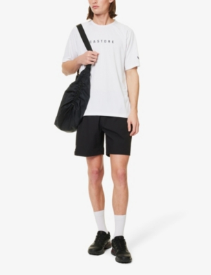 Shop Castore Brand-print Relaxed-fit Stretch-woven Shorts In Black