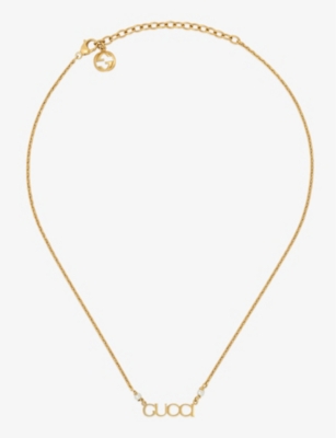 GUCCI: Logo-script glass-pearls gold-toned metal necklace