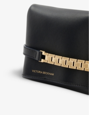 Shop Victoria Beckham Women's Black Chain-embellished Mini Leather Pouch Bag