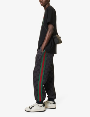 Shop Gucci Men's Grey/dark Grey/mc Monogram-patterned Tapered-leg Stretch-woven Jogging Bottoms