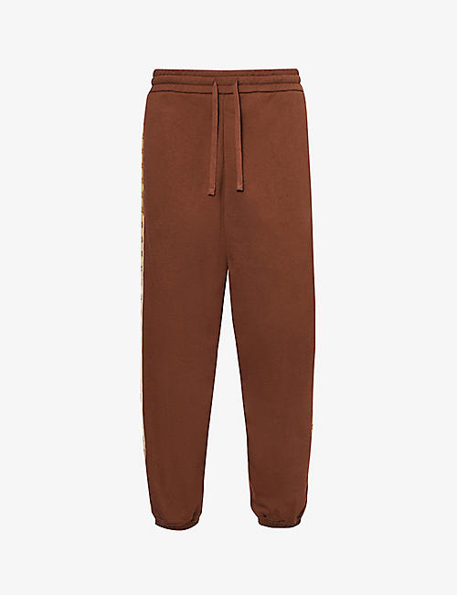 GUCCI: Monogrammed panelled cotton-jersey jogging bottoms