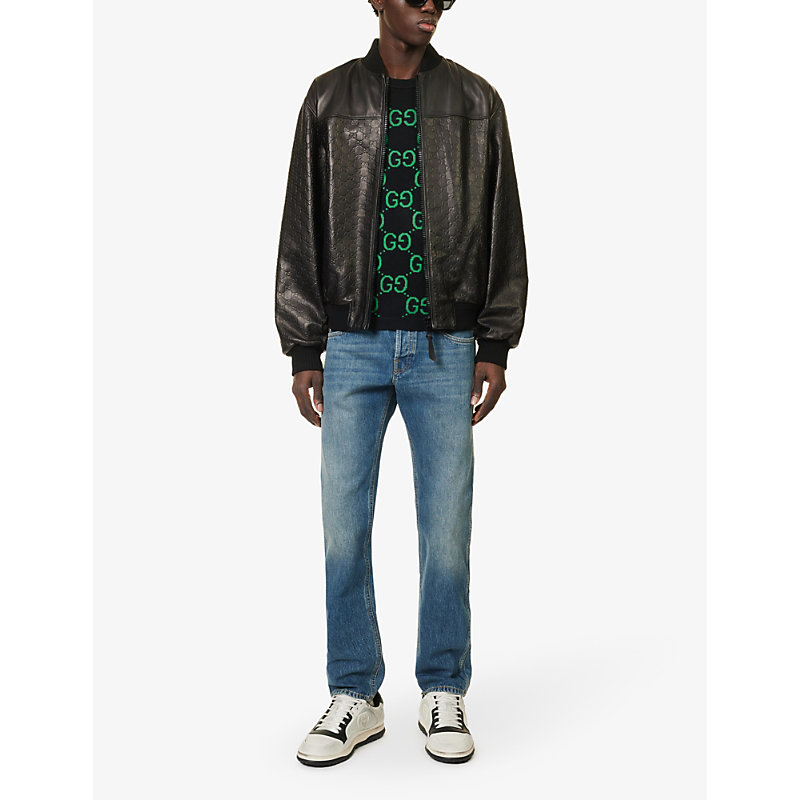 Shop Gucci Brand-patch Faded-wash Mid-rise Tapered-leg Jeans In Blue