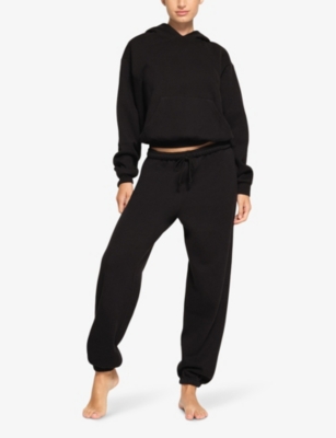 Shop Skims Relaxed-fit Cotton-blend Hoody In Onyx