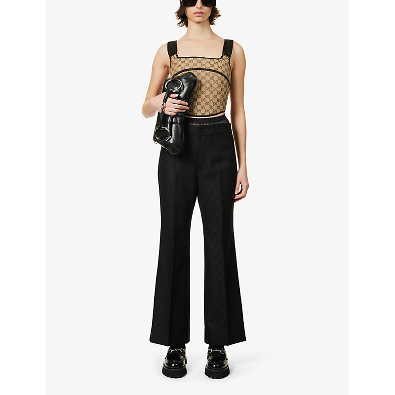 Shop Gucci Brand-print Flared-leg Mid-rise Wool Trousers In Black