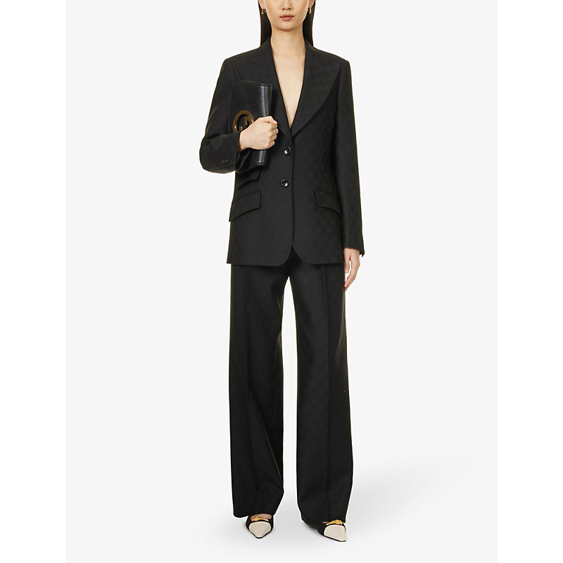 Shop Gucci Monogram-pattern Pleated Mid-rise Wool Trousers In Black