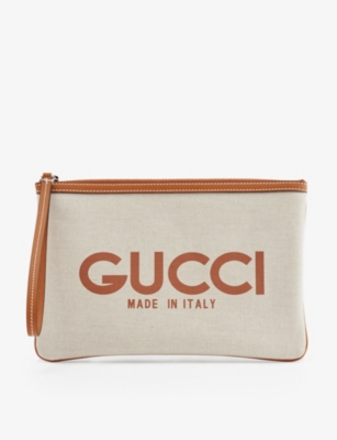 GUCCI Logo print leather trim canvas clutch Selfridges