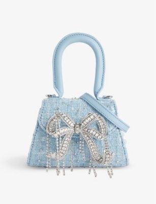 Woven top handle outlet bag