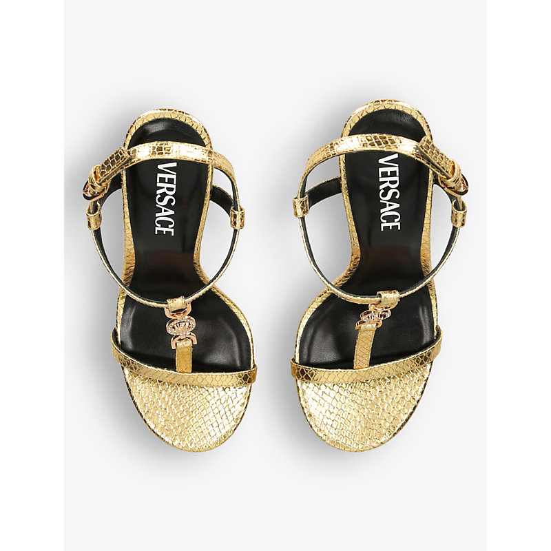 Shop Versace Women's Gold T-bar 95 Metallic-leather Heeled Sandals