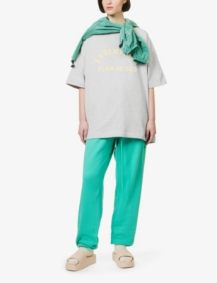Shop Essentials Fear Of God  Women's Light Heather Grey  Brand-embossed Cotton-jersey T-shirt