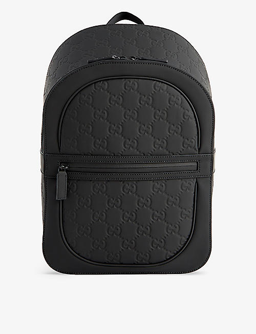GUCCI: GG logo-debossed leather backpack