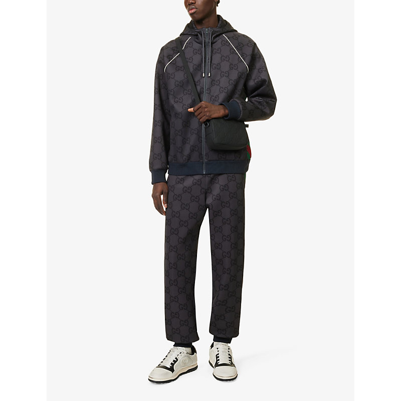 Shop Gucci Black/black/black Monogram-debossed Leather Cross-body Bag