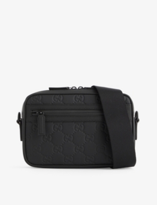 GUCCI: Monogram-debossed leather cross-body bag